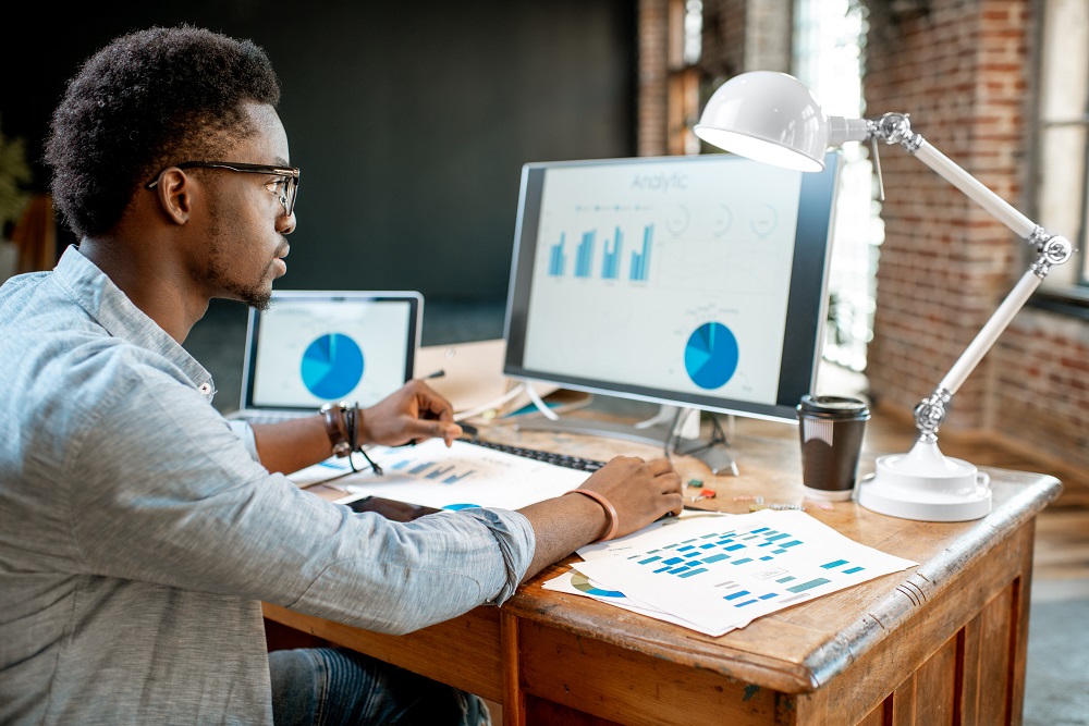 Man at office using financial tools for financial analysis