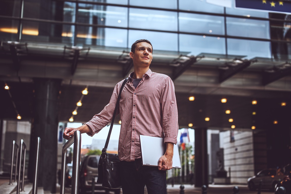 business man with laptop in hand