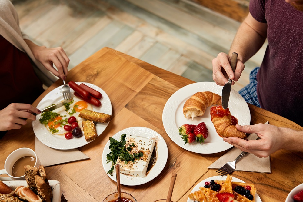 Business people eating a hotel continental breakfast